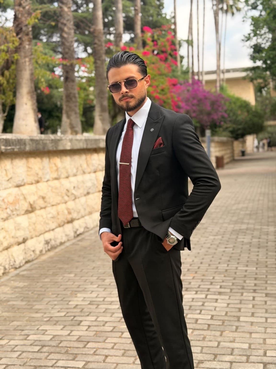 Mohamad Ahmad El Halabi in a suit on the Rafik Hariri University campus