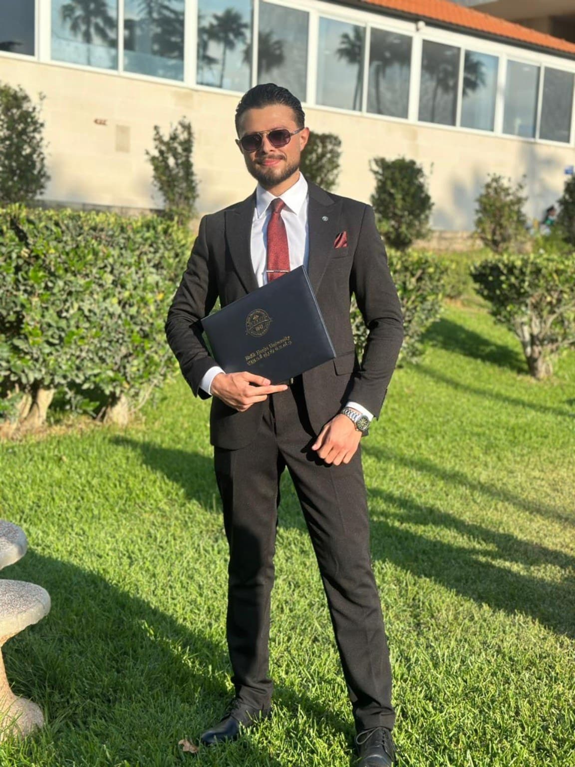 Mohamad Ahmad El Halabi holding his degree at the engineering commencement